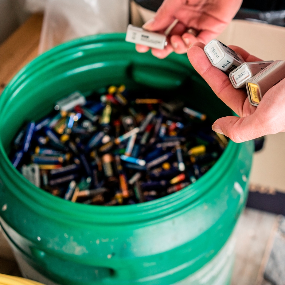 Batteries being disposed of in recycling center. Batteries being disposed of in recycling center.